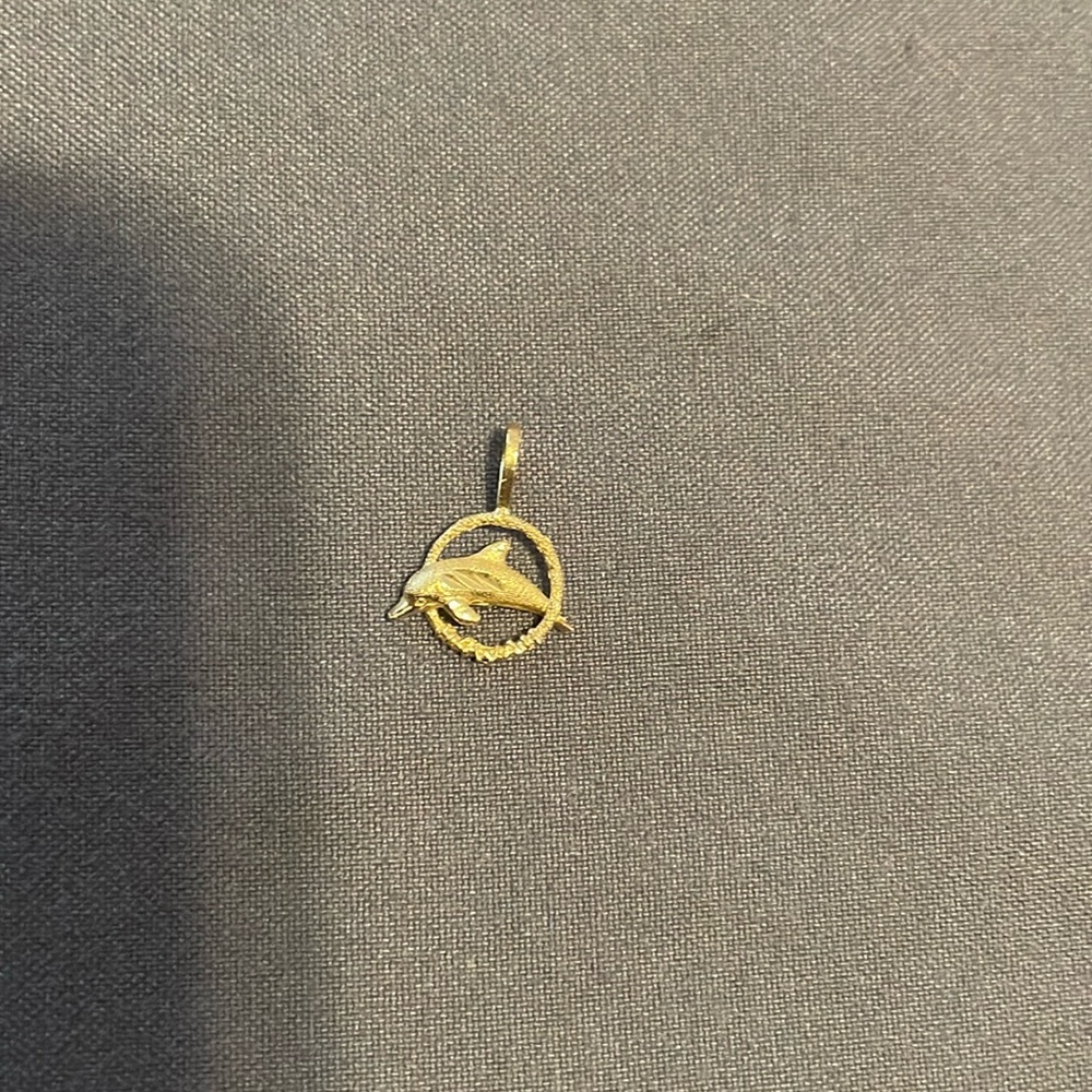 Vintage gold tone dolphin pendant